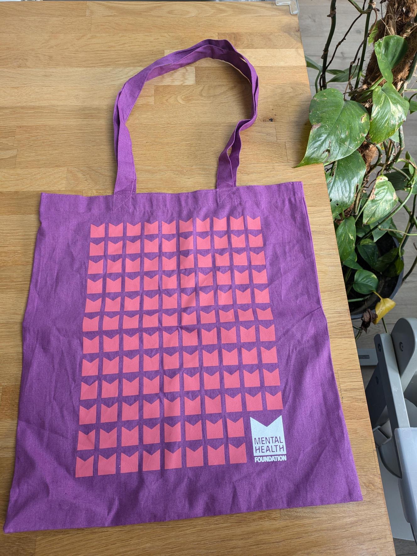 Purple tote bag with MHF logo